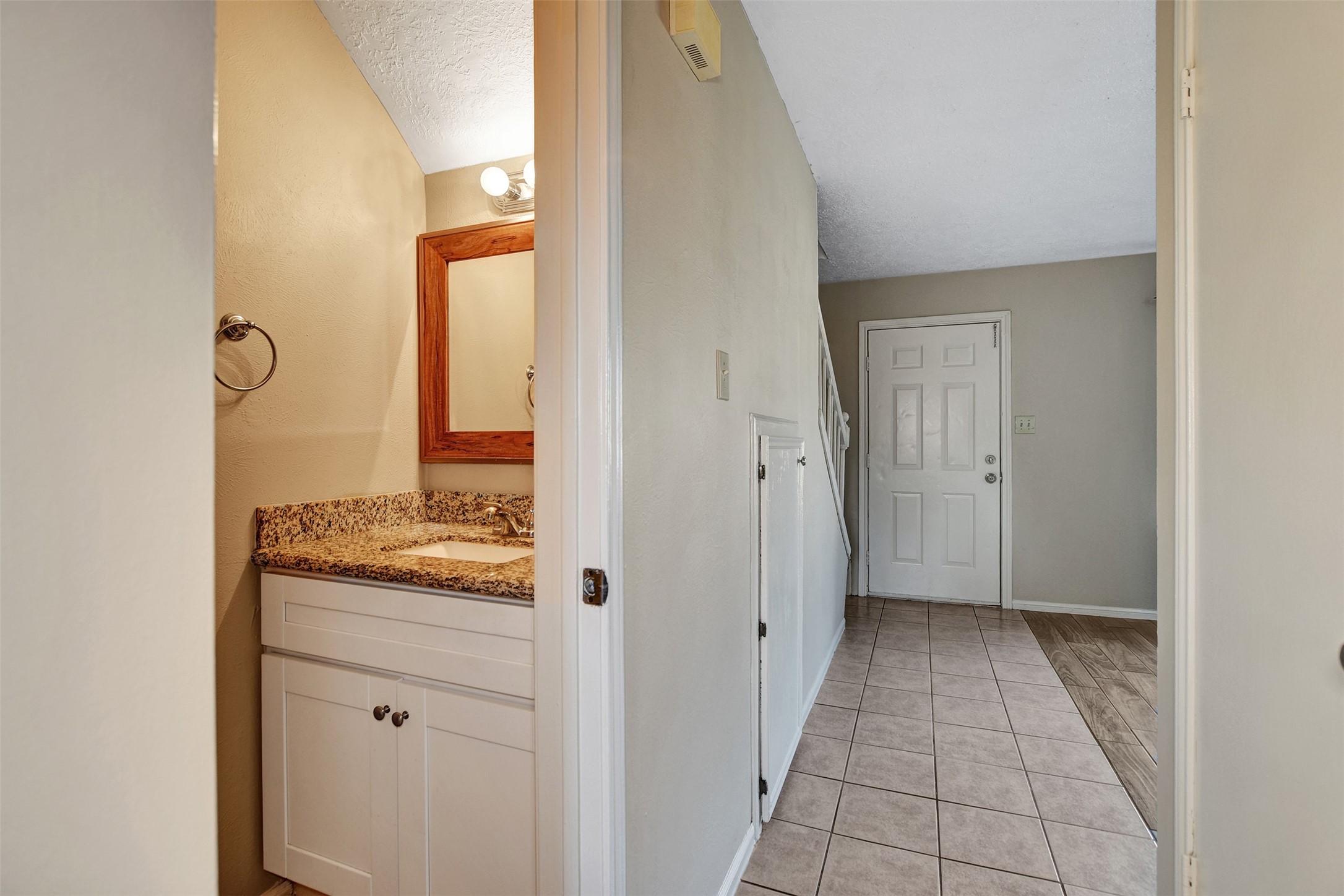 1706 Longview Street, Unit 1 Conroe, TX 77301 - Photo 17 of 32 a view of a bathroom from a hallway