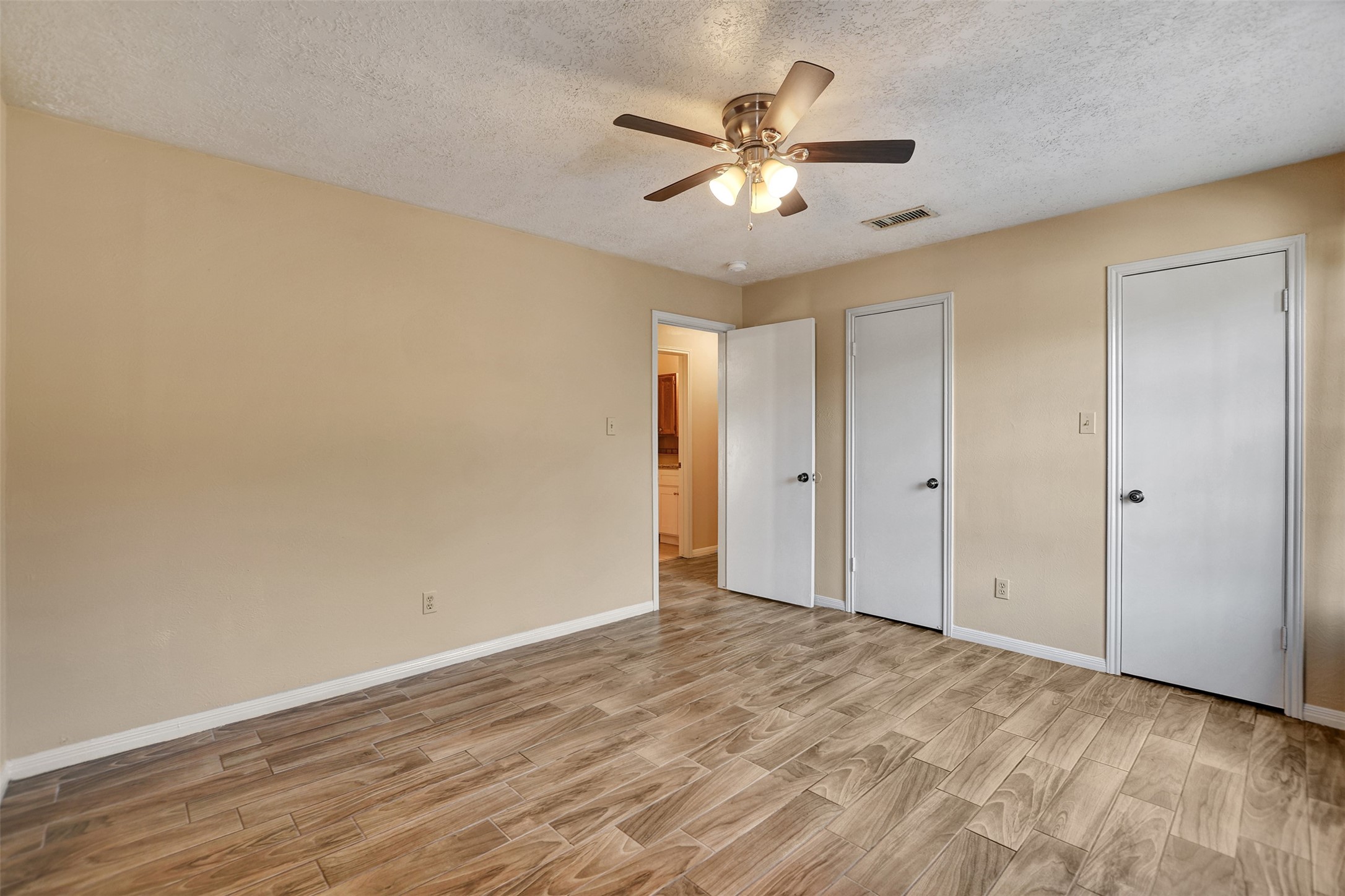 1706 Longview Street, Unit 1 Conroe, TX 77301 - Photo 23 of 32 a view of an empty room with wooden floor