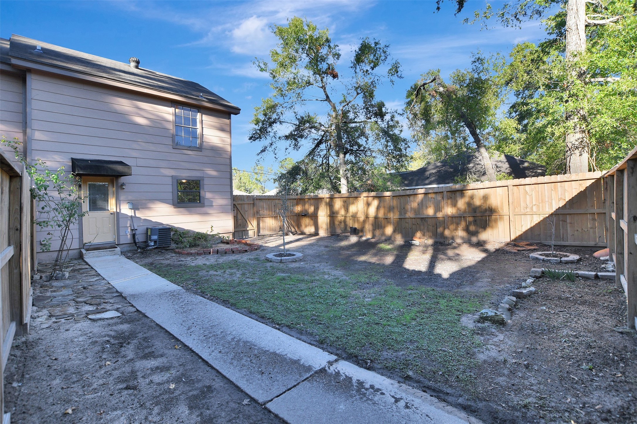 1706 Longview Street, Unit 1 Conroe, TX 77301 - Photo 29 of 32 a view of a house with a yard