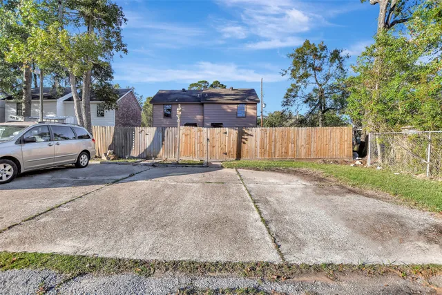 a view of a car parked in front of a house
