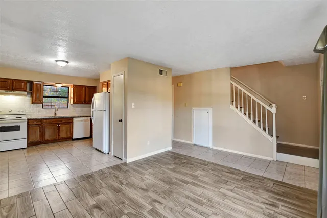 a view of a kitchen with a sink cabinets and a living room