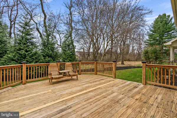 a backyard of apartments with large trees
