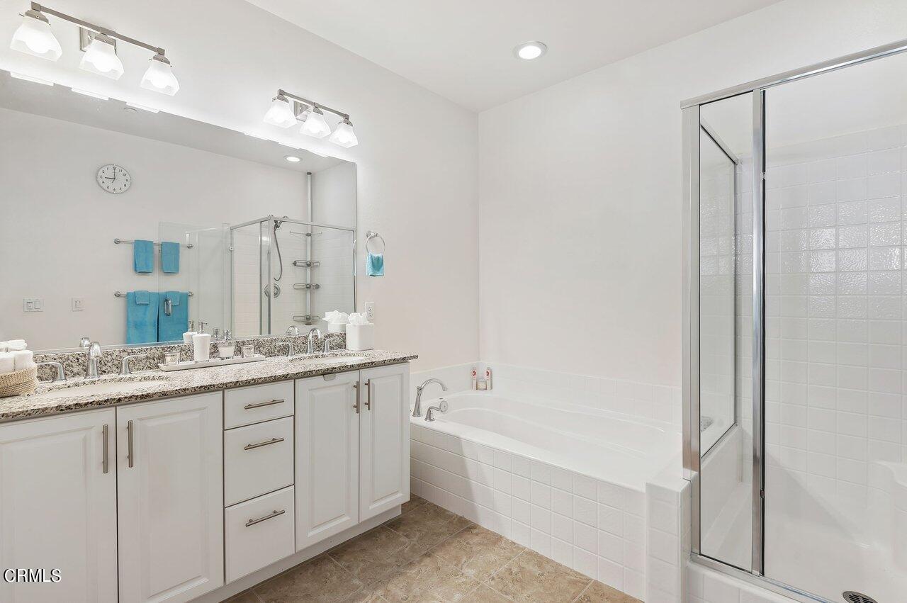 719 Forest Park Boulevard Oxnard, CA 93036 - Photo 16 of 39 a bathroom with a granite countertop sink mirror and a bathtub