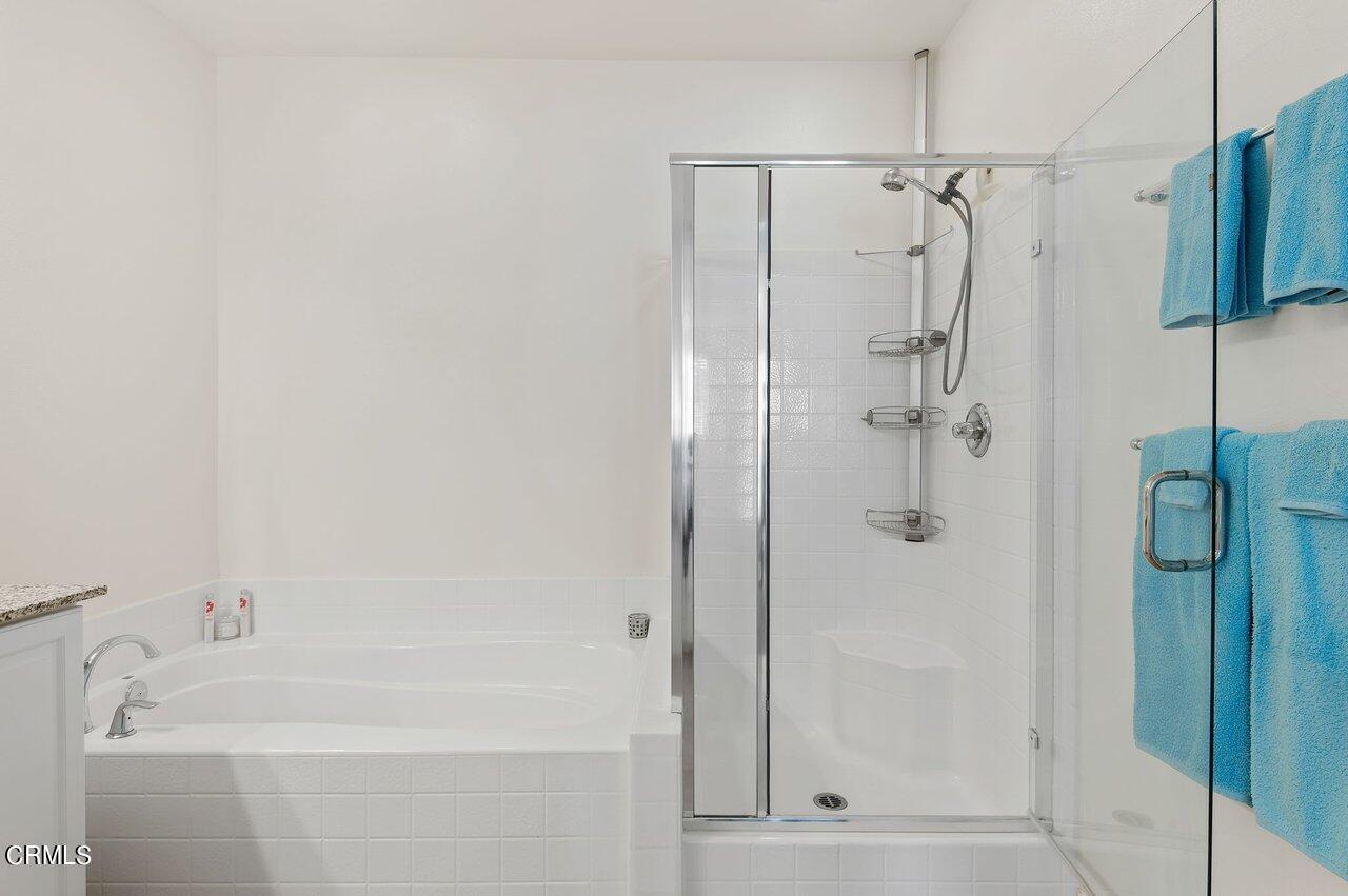 719 Forest Park Boulevard Oxnard, CA 93036 - Photo 17 of 39 a bathroom with a bathtub and shower