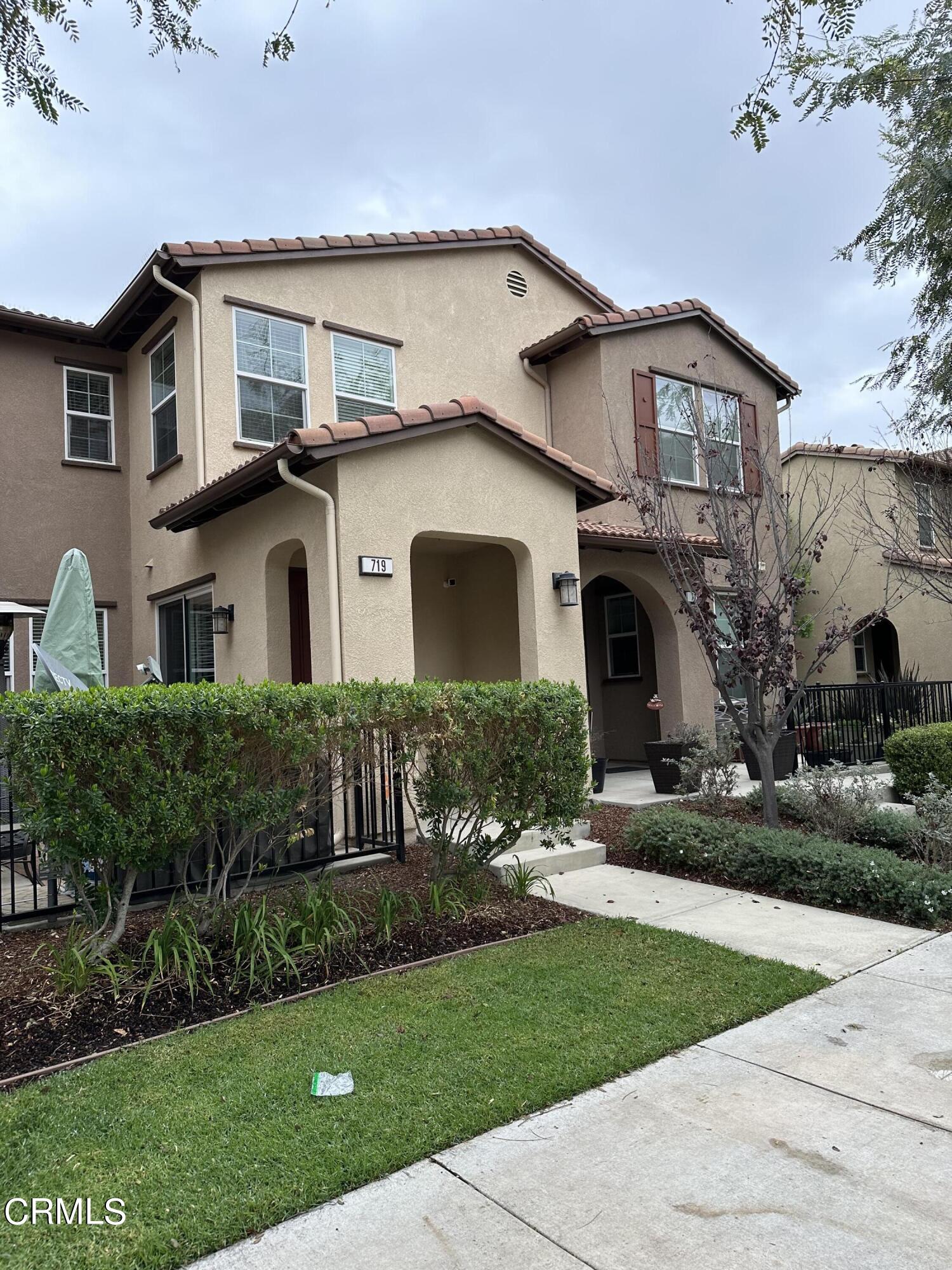 719 Forest Park Boulevard Oxnard, CA 93036 - Photo 35 of 39 a front view of a house with a yard