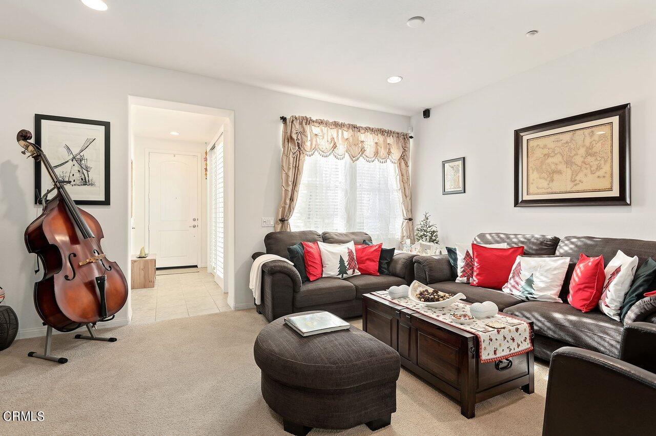 719 Forest Park Boulevard Oxnard, CA 93036 - Photo 7 of 39 a living room with furniture a air conditioner and a window