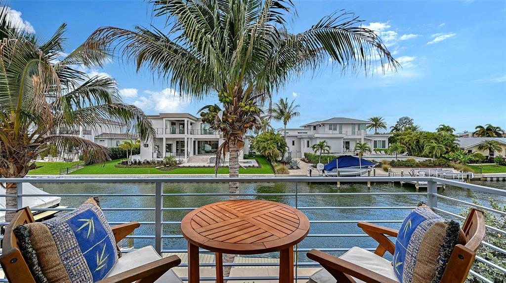 531 Wedge Lane Longboat Key, FL 34228 - Photo 12 of 28 a view of swimming pool with outdoor seating and city view