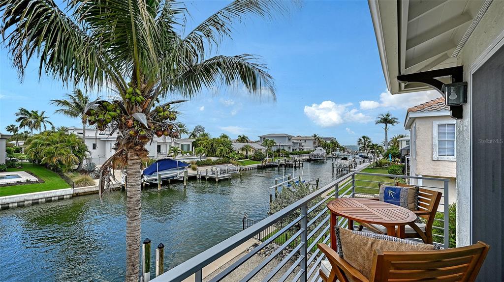 531 Wedge Lane Longboat Key, FL 34228 - Photo 13 of 28 a view of a balcony with lake view and a back yard
