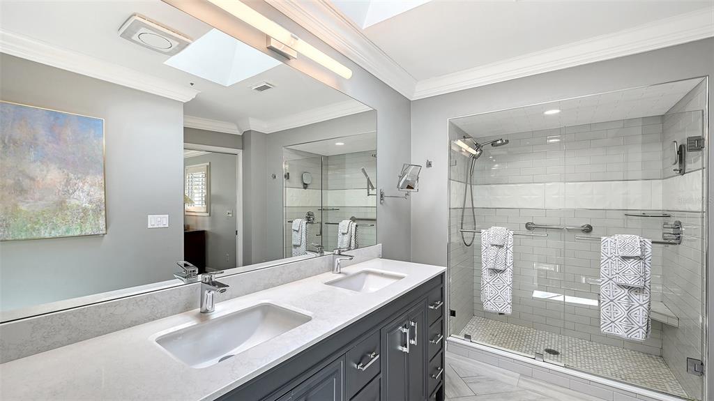 531 Wedge Lane Longboat Key, FL 34228 - Photo 14 of 28 a bathroom with a double vanity sink mirror and shower