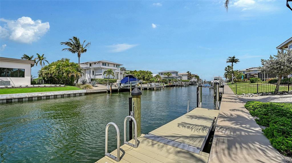 531 Wedge Lane Longboat Key, FL 34228 - Photo 20 of 28 a view of a lake with houses