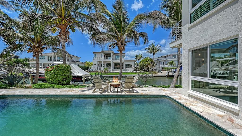 531 Wedge Lane Longboat Key, FL 34228 - Photo 27 of 28 a front view of a house with a garden