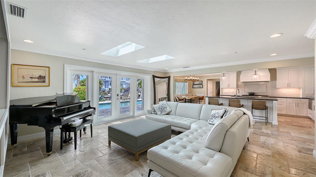 531 Wedge Lane Longboat Key, FL 34228 - Photo 8 of 28 a living room with furniture and kitchen view