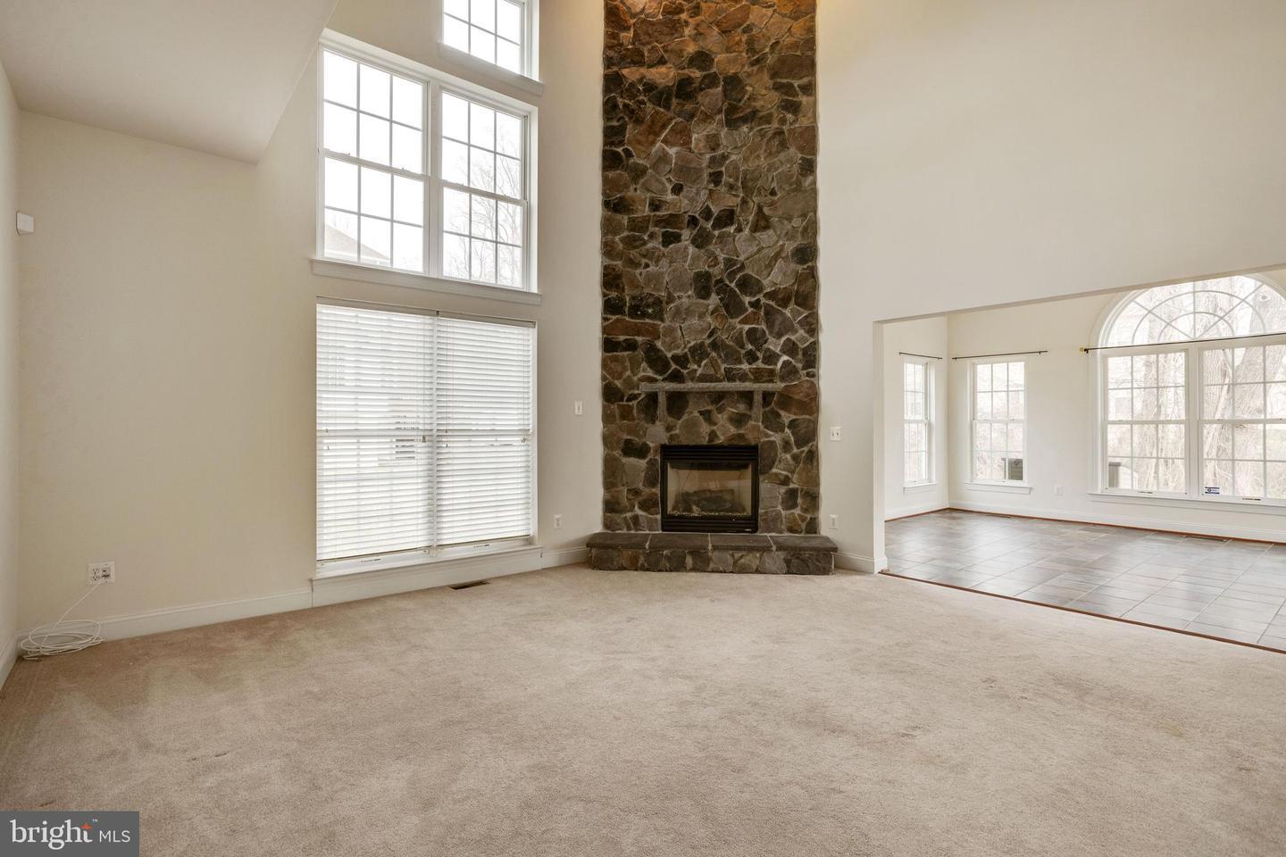 19237 Potomac Crest Drive Triangle, VA 22172 - Photo 10 of 29 Spacious living area with stone fireplace