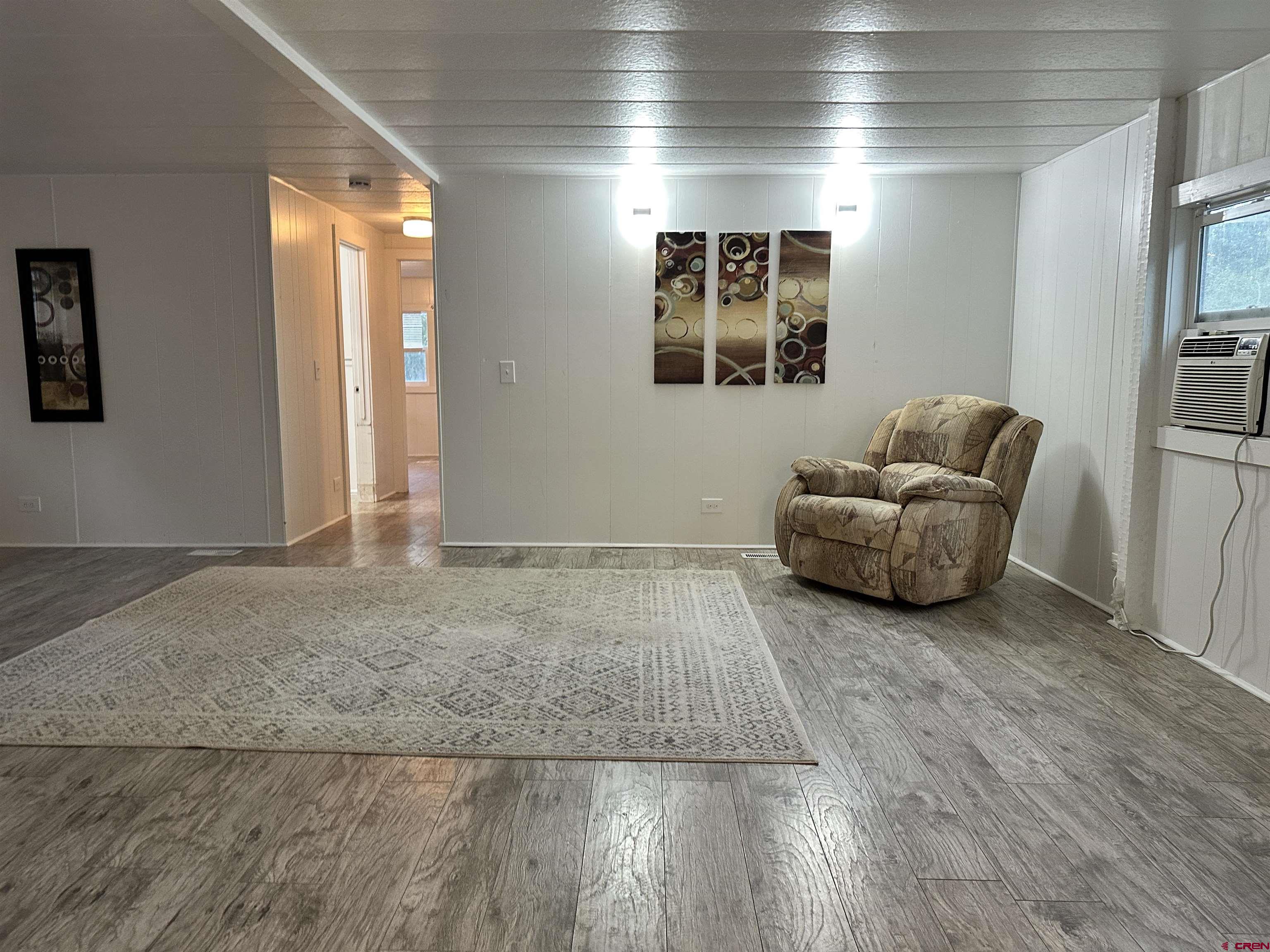 468 Rio Grande Road South Fork, CO 81154 - Photo 18 of 43 a living room with furniture and a rug