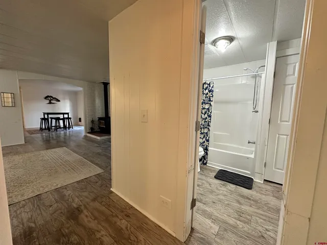 a livingroom with furniture and a flat screen tv