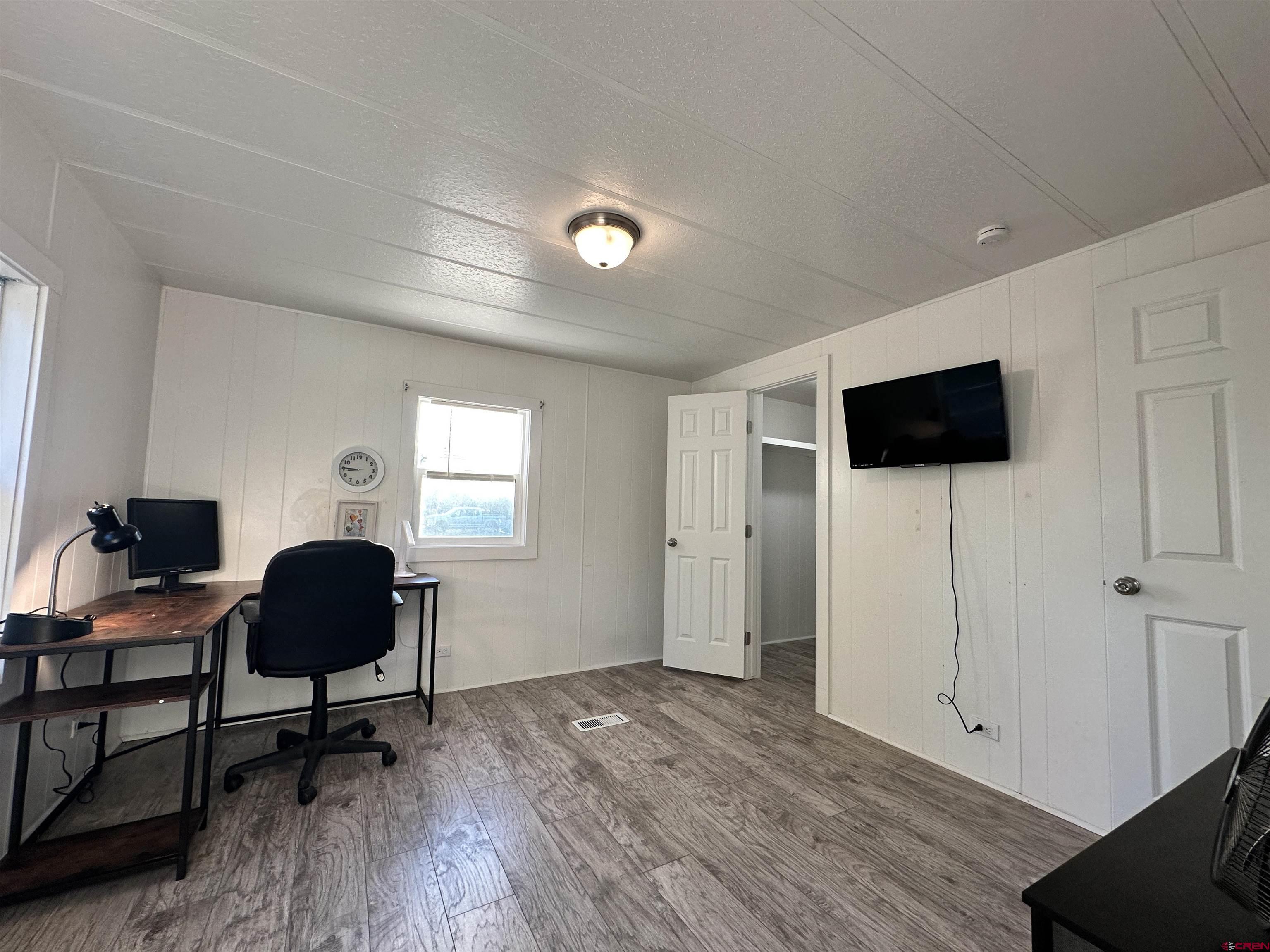 468 Rio Grande Road South Fork, CO 81154 - Photo 31 of 43 a livingroom with furniture and a flat screen tv
