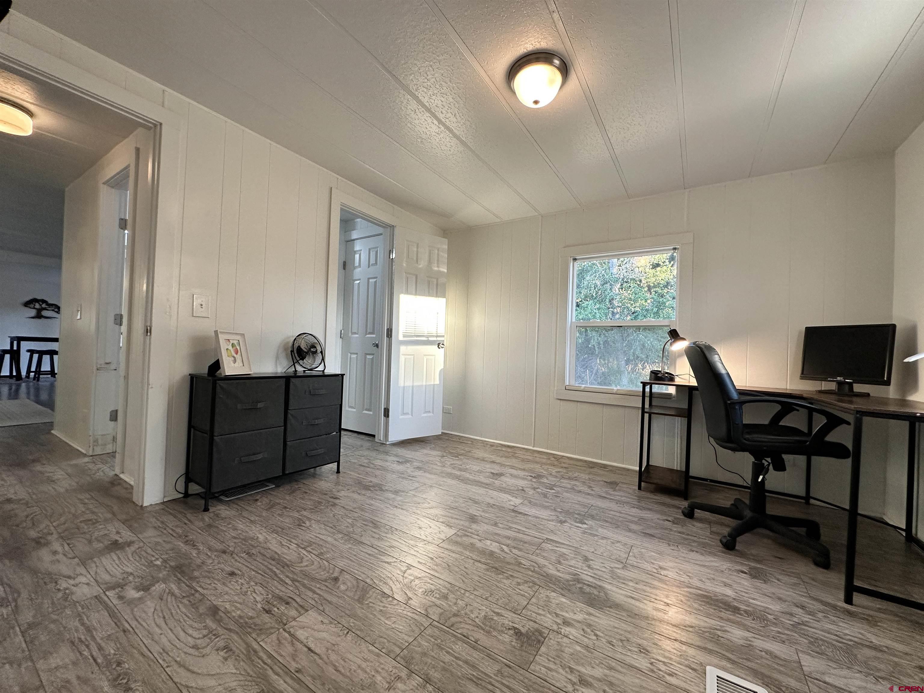 468 Rio Grande Road South Fork, CO 81154 - Photo 32 of 43 a view of a workspace with furniture and a window