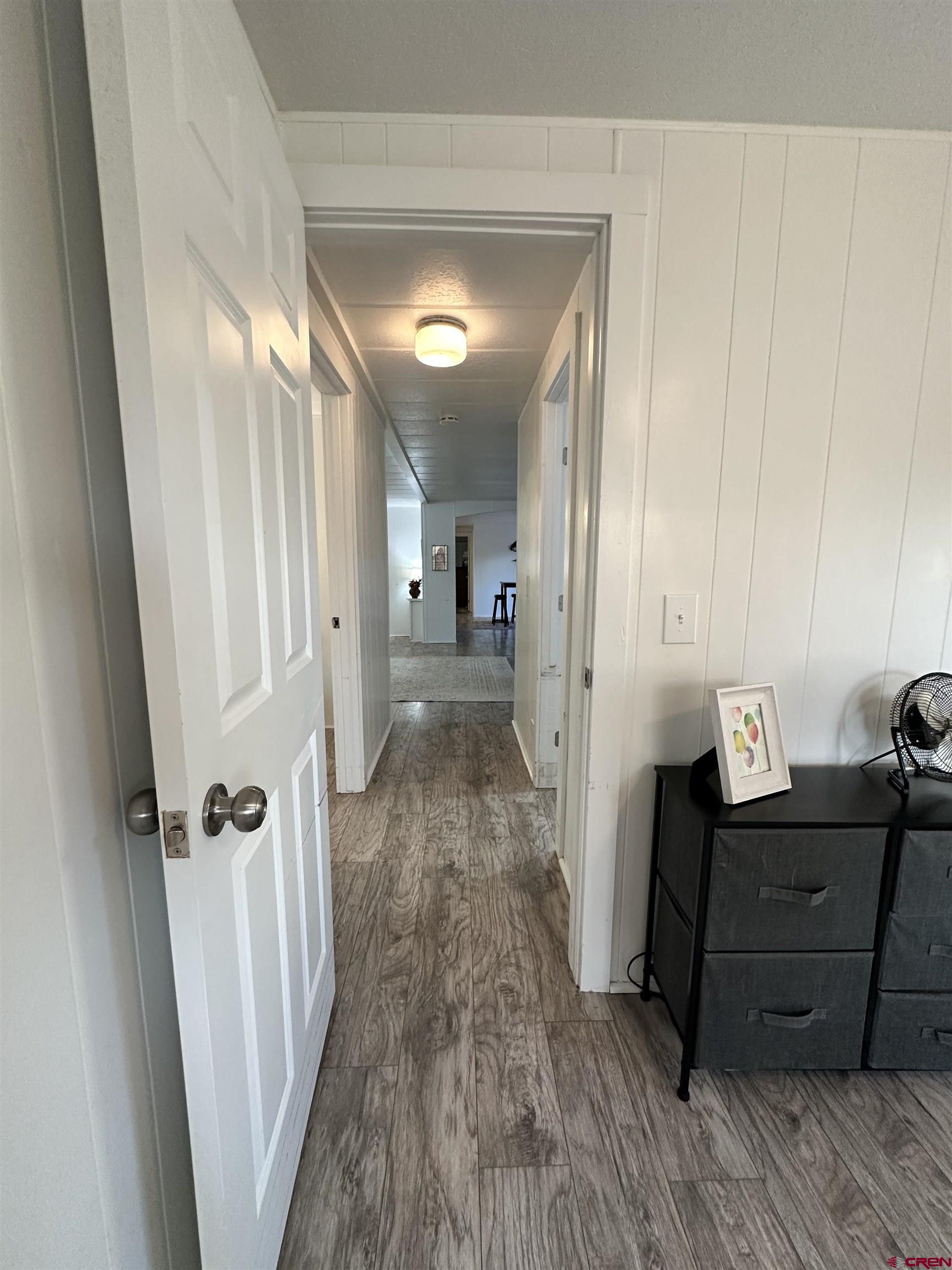 468 Rio Grande Road South Fork, CO 81154 - Photo 33 of 43 a view of a hallway with wooden floor and staircase