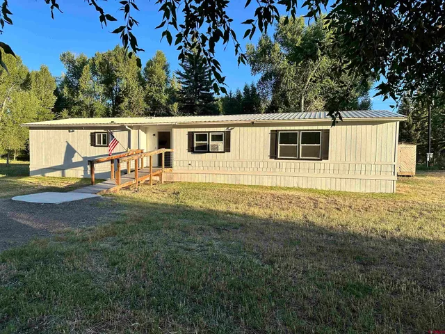 a view of outdoor space with garden and seating