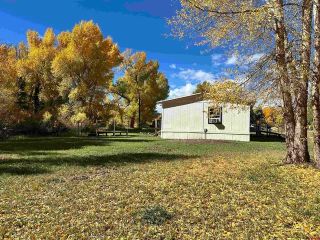 a balcony with table and chairs