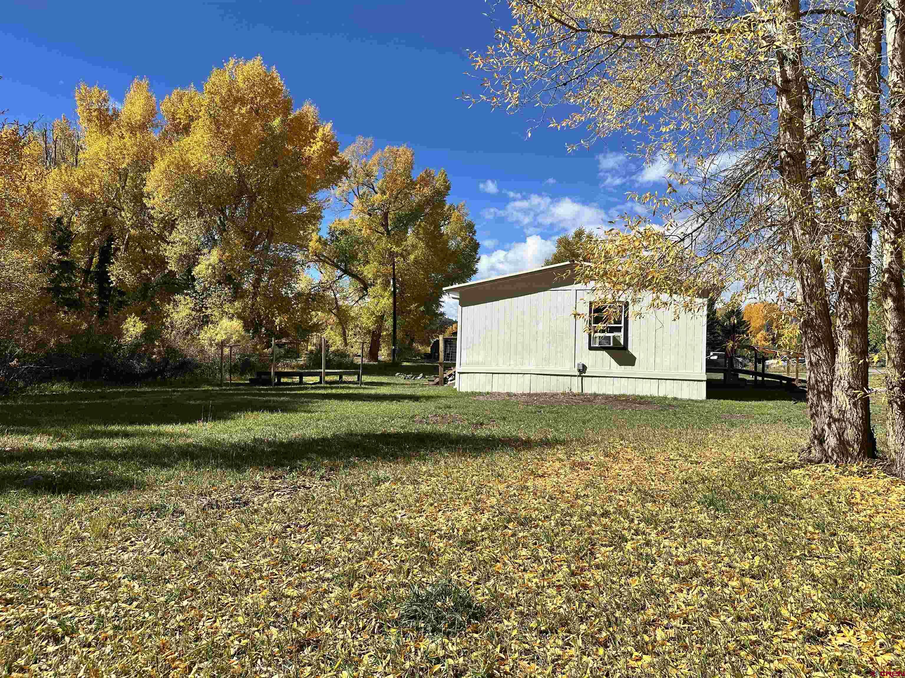 468 Rio Grande Road South Fork, CO 81154 - Photo 38 of 43 a view of a house with a yard