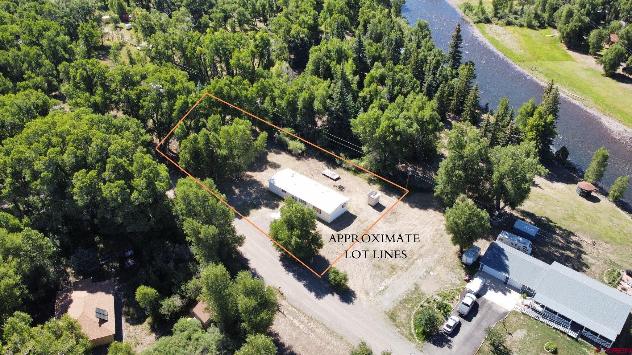 468 Rio Grande Road South Fork, CO 81154 - Photo 4 of 43 a sign that is sitting in front of flowers