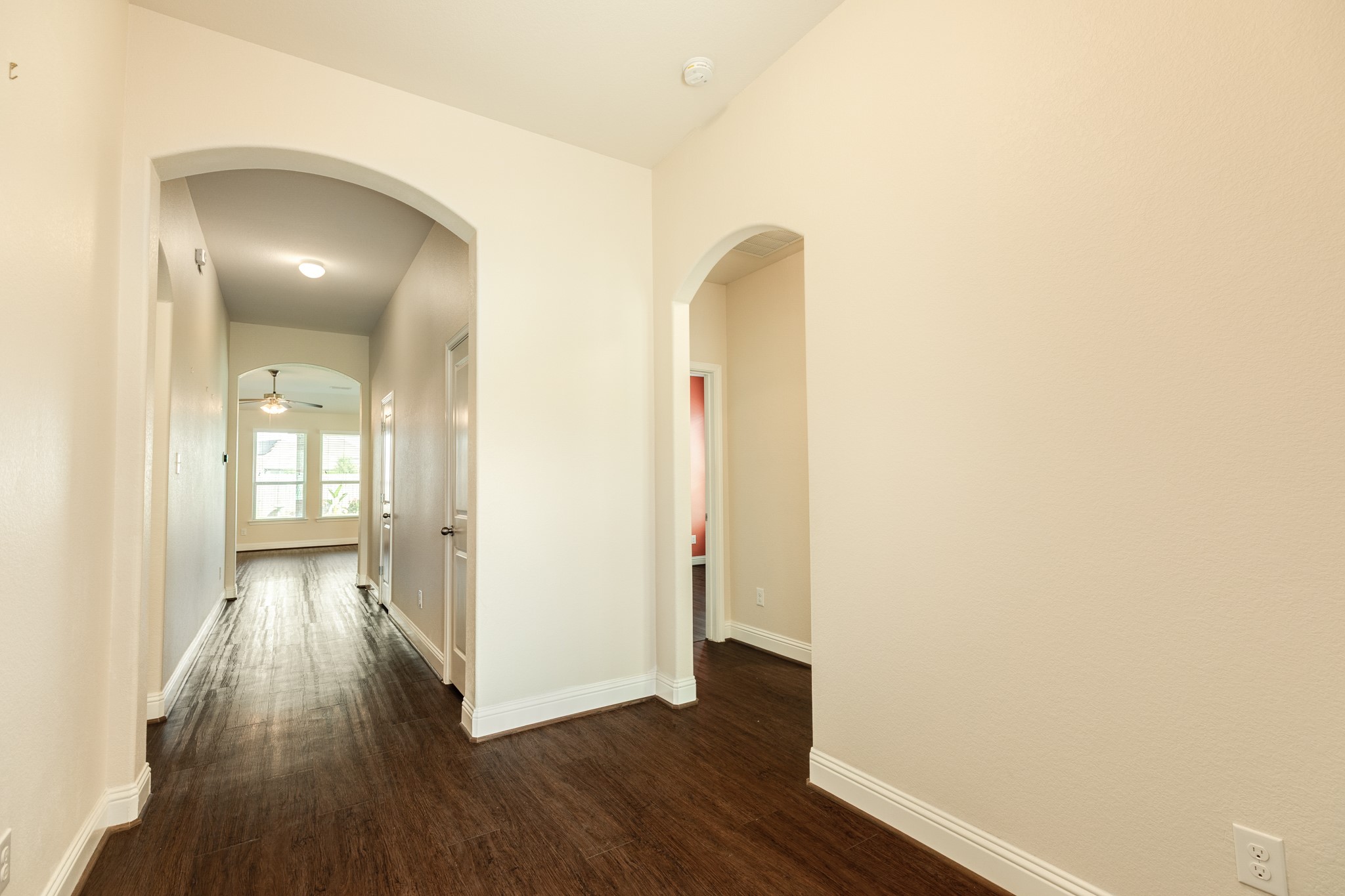 3519 Bay Drive Rosharon, TX 77583 - Photo 49 of 49 As you continue down the hallway, you will find two closets on your right, providing convenient storage before you enter the seamless, open-concept floor plan that connects the family room, kitchen, and dining area. This layout is designed for modern living, offering an effortless flow that is perfect for both daily activities and entertaining guests.