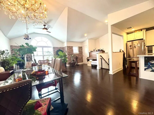 a view of a living room and dining room