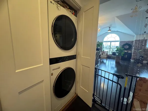 a view of a hallway with washer and dryer