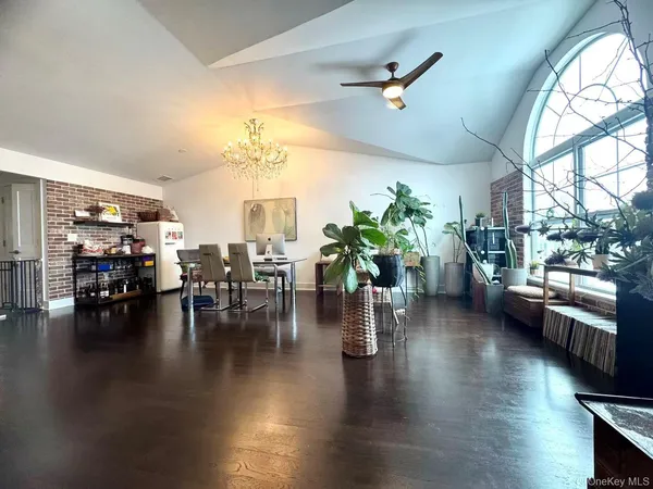 a lobby with furniture and a potted plant