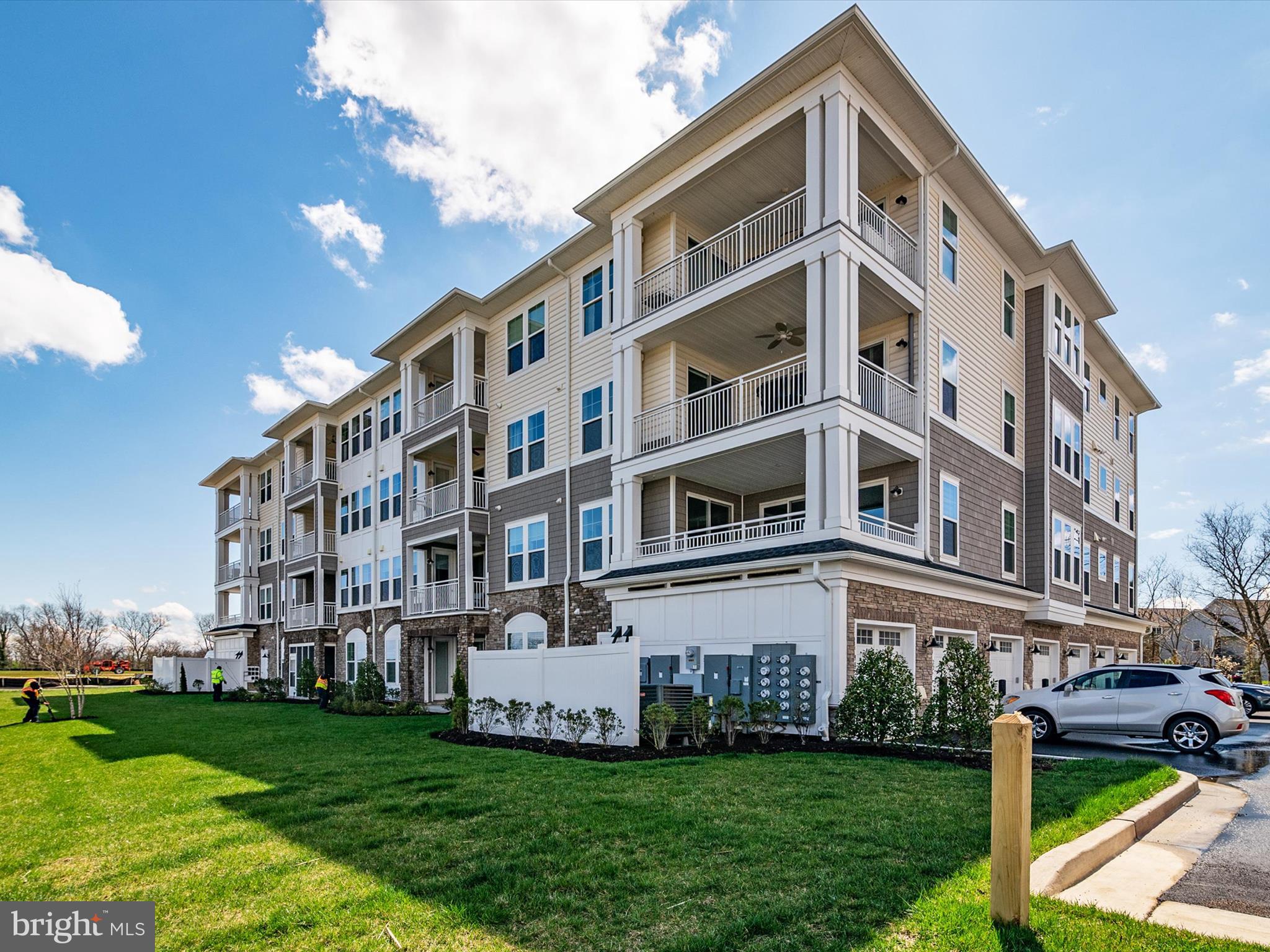 141 Switchgrass Way, Unit 34 Chester, MD 21619 - Photo 35 of 61 a front view of a building with a yard