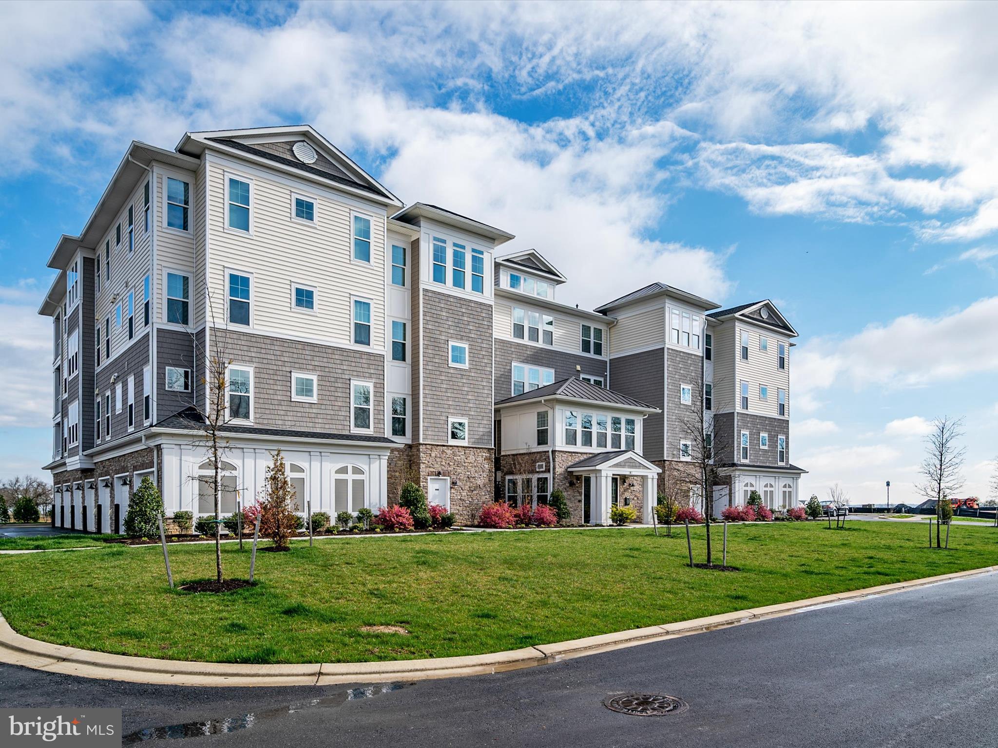 141 Switchgrass Way, Unit 34 Chester, MD 21619 - Photo 51 of 61 a view of a white building among the side of a yard
