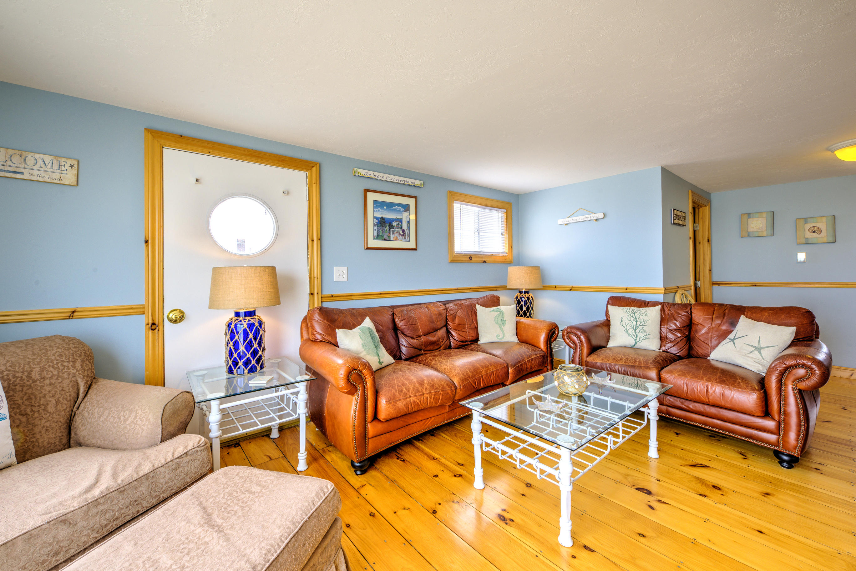 215 Phillips Road Sandwich, MA 02563 - Photo 6 of 26 a living room with furniture a rug and a window