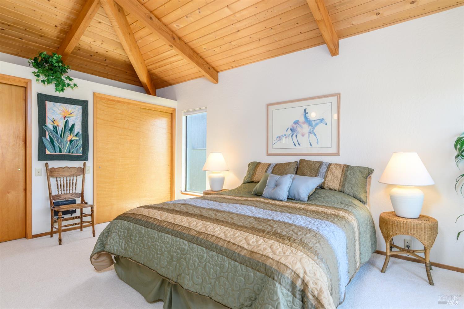 267 Sea Stack The Sea Ranch, CA 95497 - Photo 26 of 35 a bedroom with a bed and a painting on the wall