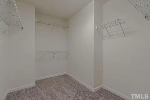 a bathroom with a granite countertop sink a large mirror and a bathtub