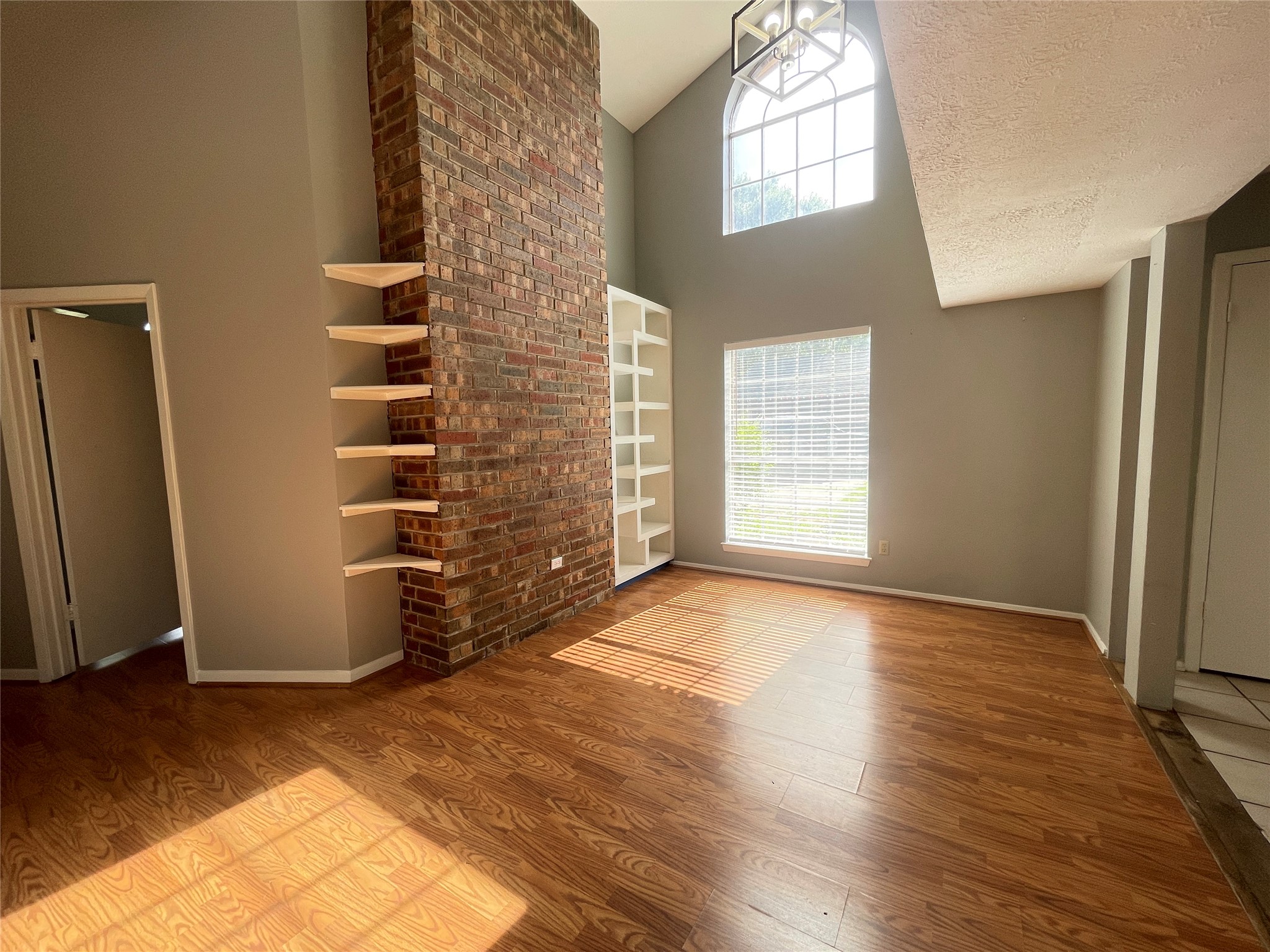 5006 Temple Bell Drive Spring, TX 77388 - Photo 5 of 27 The Dining Room has a beautiful brick accent wall, which is the backside of the fireplace in the next room