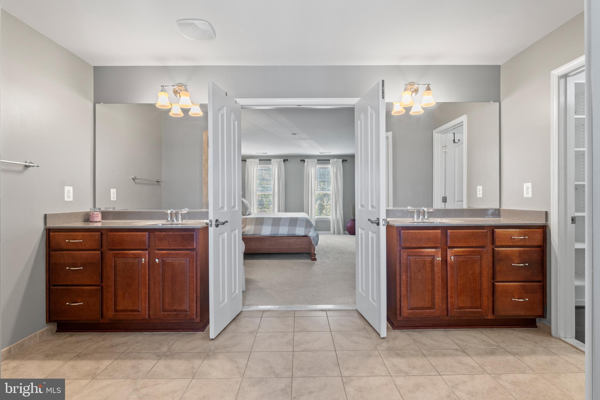 16 Barley Mill Court Stafford, VA 22554 - Photo 24 of 48 a spacious bathroom with a granite countertop sink and a mirror