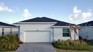 3495 Harborside Avenue Fort Pierce, FL 34946 - Photo 1 of 15 a front view of a house with garden