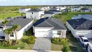 3495 Harborside Avenue Fort Pierce, FL 34946 - Photo 2 of 15 an aerial view of a house with a yard