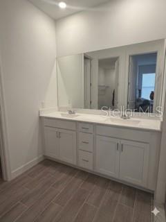 3495 Harborside Avenue Fort Pierce, FL 34946 - Photo 3 of 15 a spacious bathroom with a double vanity sink and a mirror