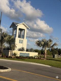 3495 Harborside Avenue Fort Pierce, FL 34946 - Photo 8 of 15 a front view of a house with a yard and garage