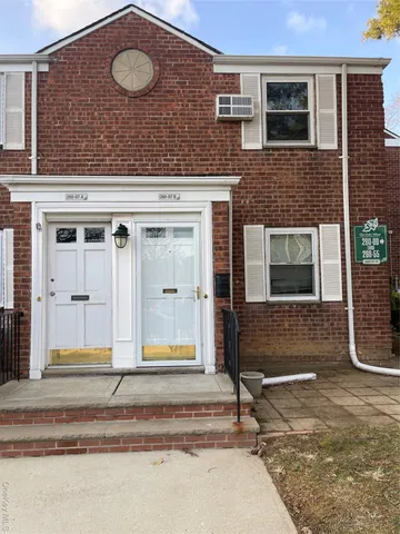 a view of a brick house with front door