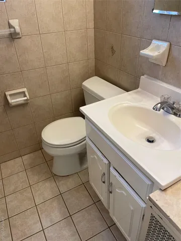 a bathroom with a sink and toilet
