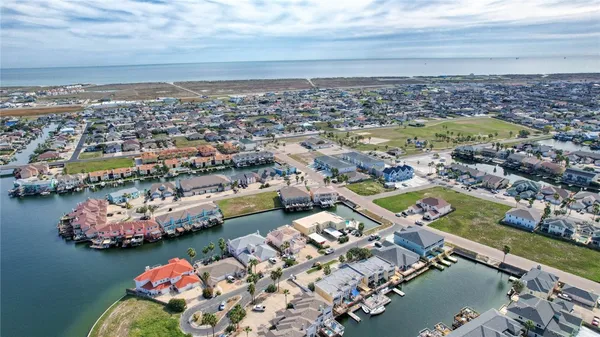 an aerial view of a city with lawn chairs