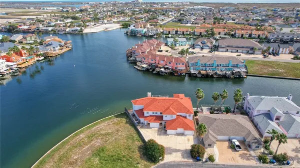 an aerial view of a house with a ocean view