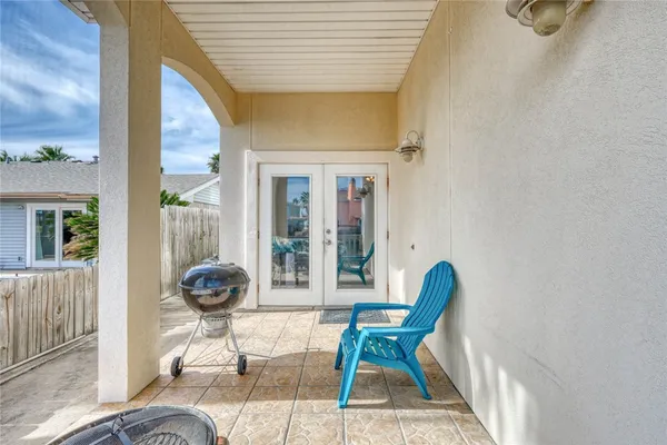a view of balcony and dining area with furniture