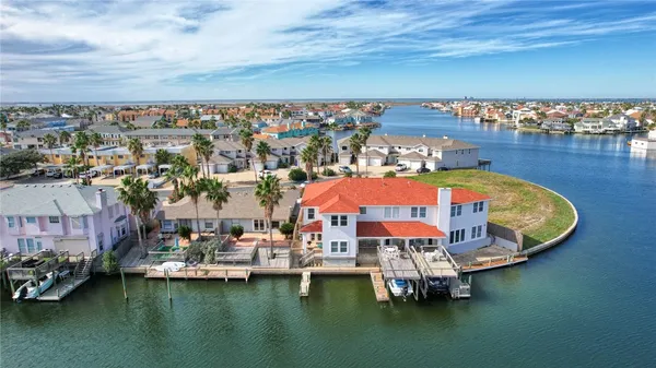 an aerial view of a house with a ocean view