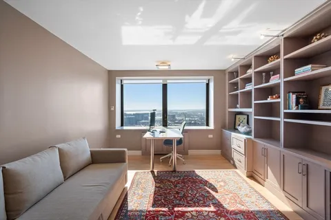 a living room with furniture and a rug