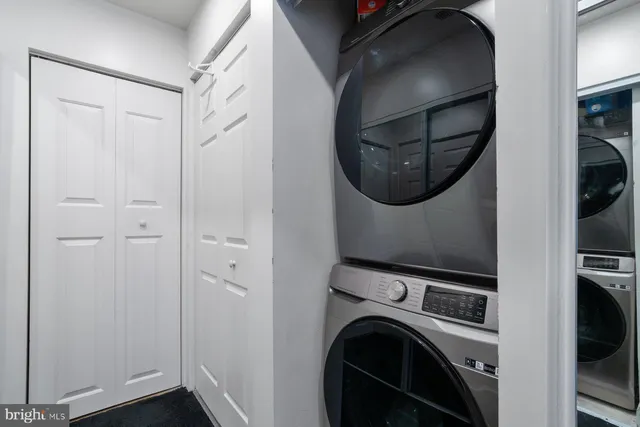 a view of a hallway with washer and dryer