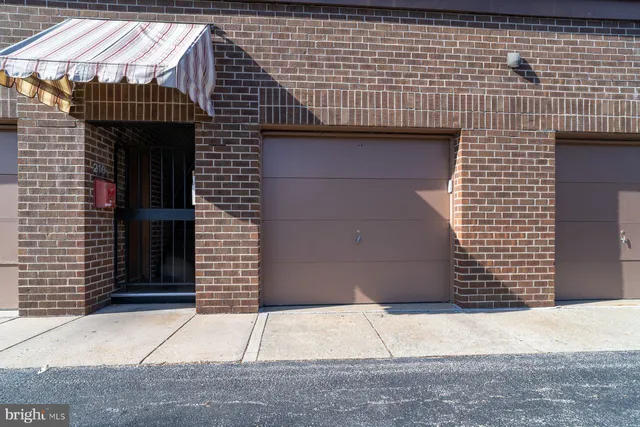a front view of a house with a white door